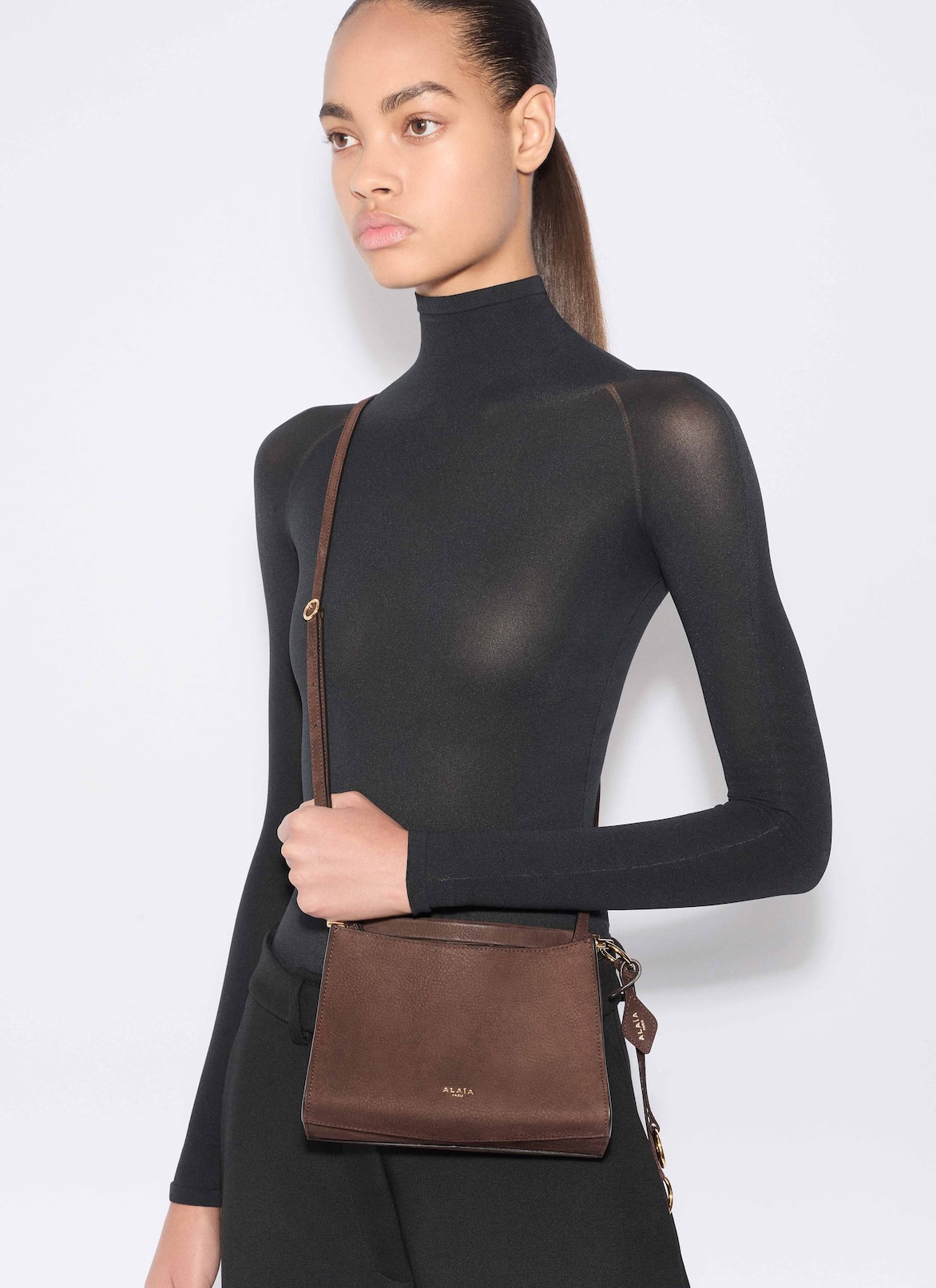LE CLICK SMALL SQUARE BAG IN NUBUCK  ALAÏA DARK BROWN LE CLICK SMALL SQUARE BAG IN NUBUCK